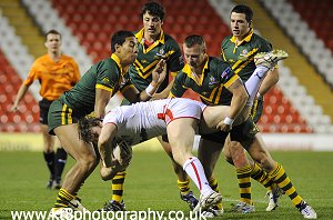 Christopher Grevsmuhl-Gemmell & Harry Siejka combine to tackle Academy Player while Iain Riccardi & Lachlan Burr look on 