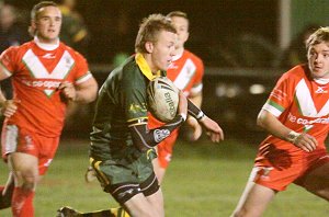 Henare Wells running thru the Welsh Defence