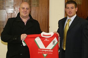 Paul Carter is presented with a Welsh jumper