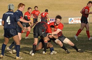 Tim Armstrong wraps up an opponent in an earlier win in the University Shield knockout competition.