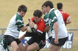 Brodie Chapman gets taken down in a tackle against Cronulla in the University Shield quarter final.