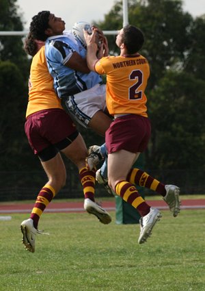 Albert Kelly (Patrician Bro's) flies for the footy ( Photo : ourfooty media)