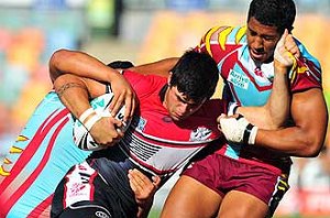 Kirwan's Jai Ingram tries to shrug off a Keebra tackle during yesterday's final. Photo: SCOTT RADFORD-CHISHOLM 